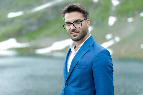 Smart casual fashion model wearing blue coat outdoor — Stock Photo, Image