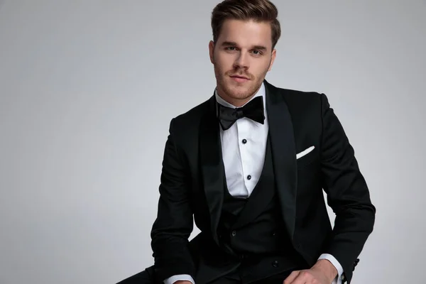 Young modern groom wearing black suit and bowtie — Stock Photo, Image