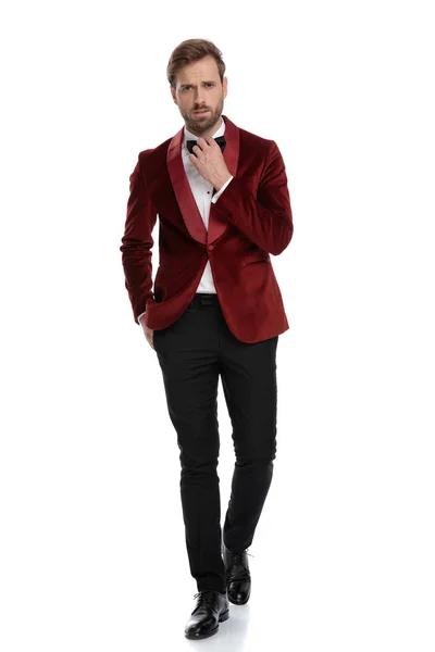 Arrogant fashion model wearing red velvet tuxedo — Stock Photo, Image