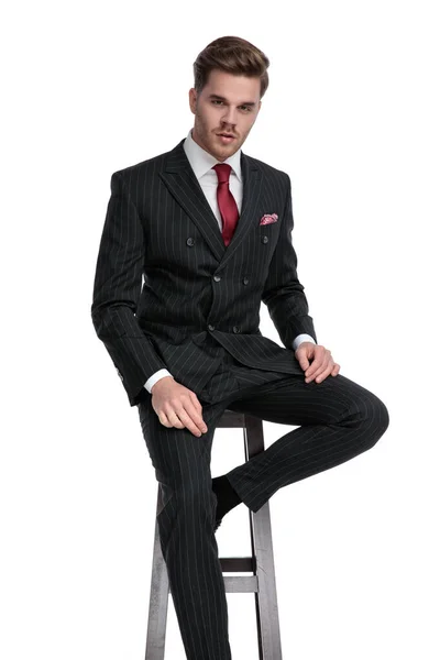 Attractive young businessman wearing double breasted suit and re — Stock Photo, Image