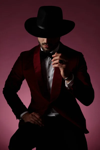 Mysterious fashion model wearing red velvet tuxedo — Stock Photo, Image