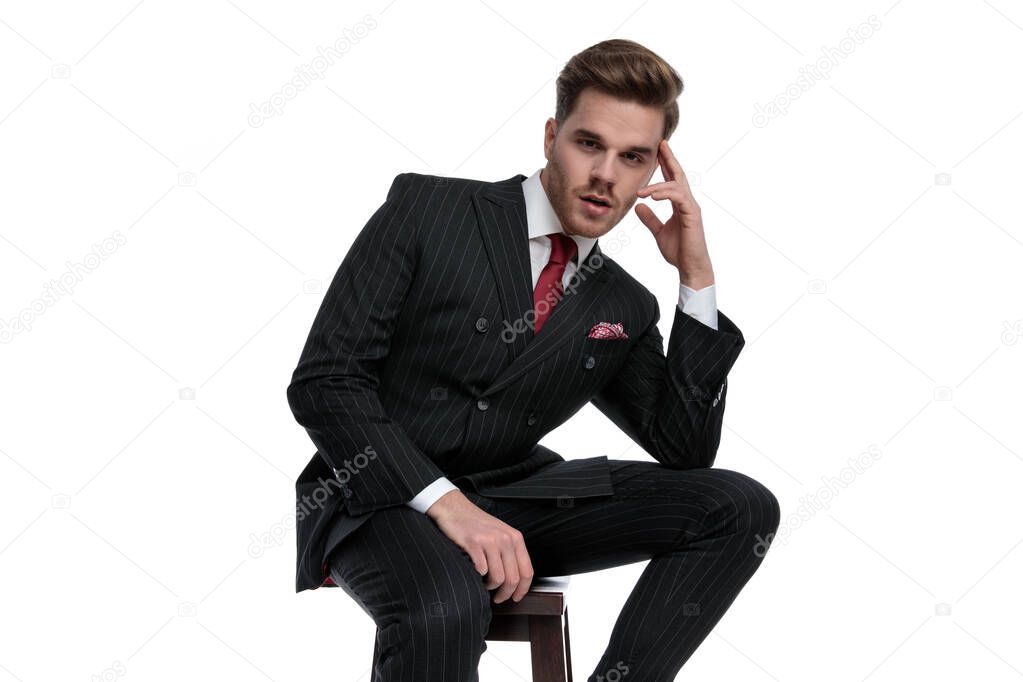 elegant modern businessman wearing double breasted suit and red 