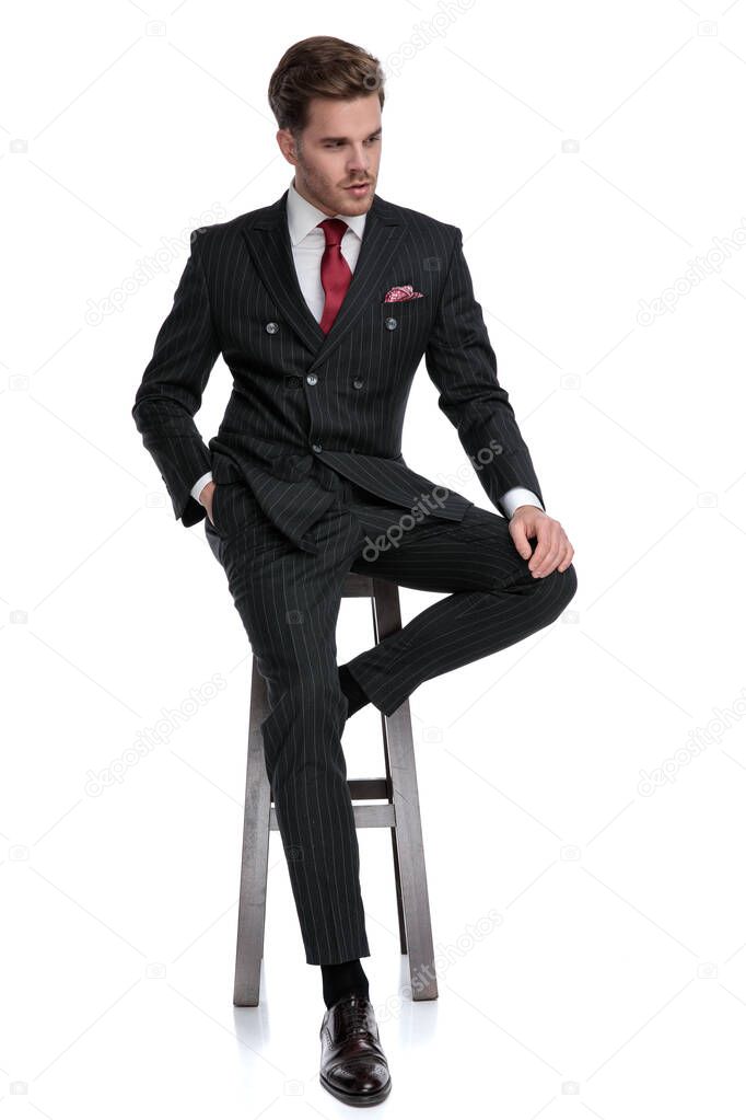 modern fashion model wearing double breasted suit and red tie