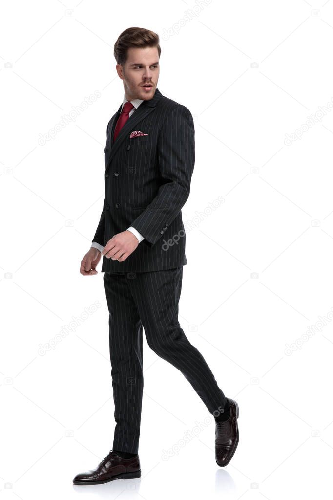 Elegant businessman wearing double breasted suit and red tie