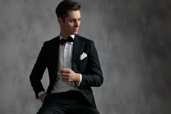 Young elegant model in tuxedo looking to side — Stock Photo, Image