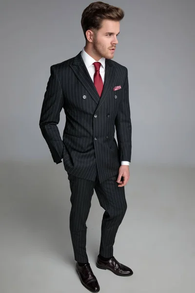 Young fashion model wearing double breasted suit — Stock Photo, Image