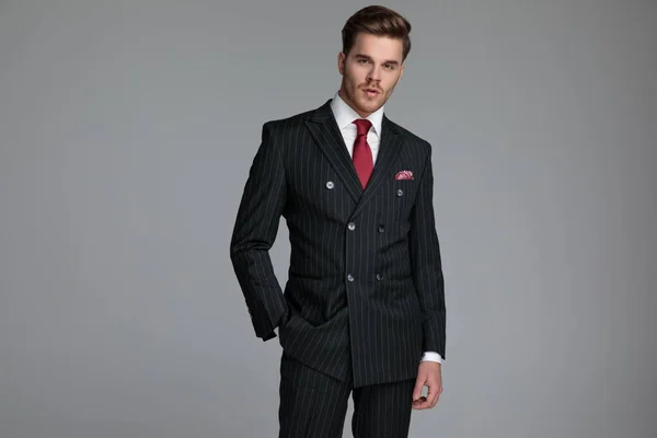 Young fashion model wearing double breasted suit — Stock Photo, Image