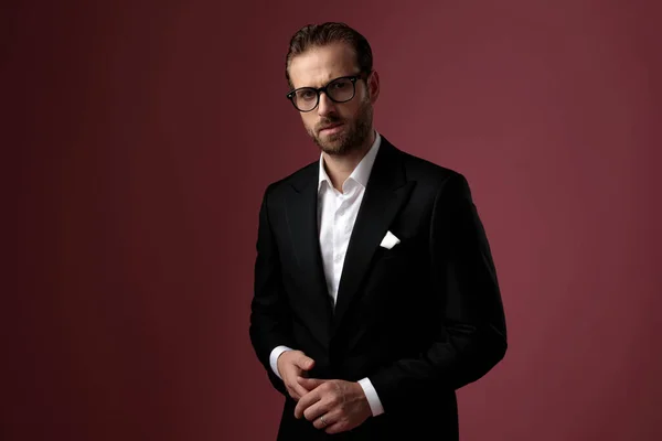 Confident elegant man playing with his hands — Stock Photo, Image