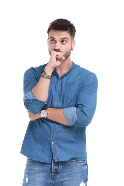 Anxious casual man covering his mouth with his fist — Stock Photo, Image