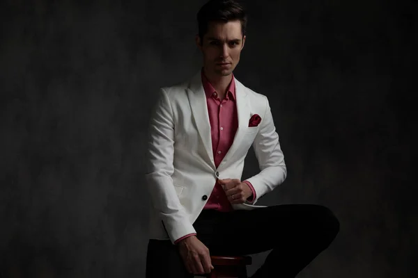 Handsome elegant adjusting his jacket — Stock Photo, Image