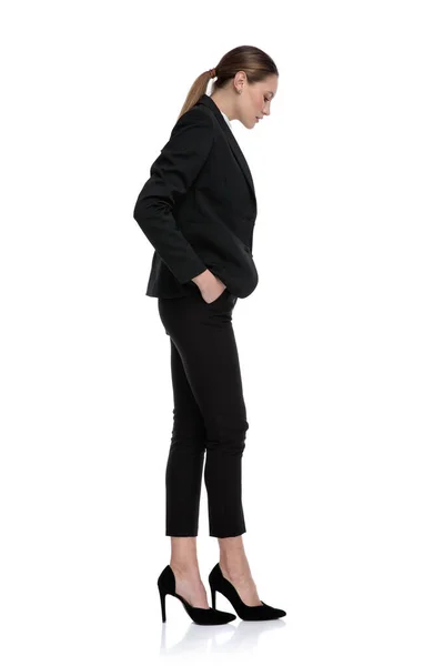 Businesswoman waiting in line and looking down disappointed Stock Image