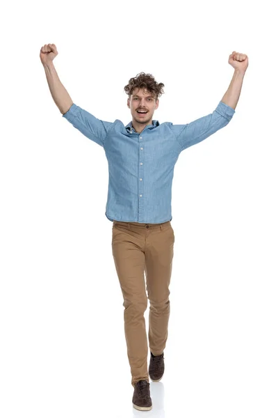 Excited Young Man Holding Arms Air Cheering Walking Isolated White — Stock Photo, Image