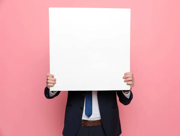 Happy Elegant Businessman Suit Hiding Empty Board Standing Pink Background — Stock Photo, Image
