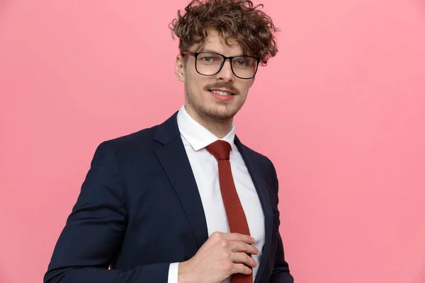 Happy Young Businessman Navy Blue Suit Wearing Glasses Arranging Tie — Stock Photo, Image