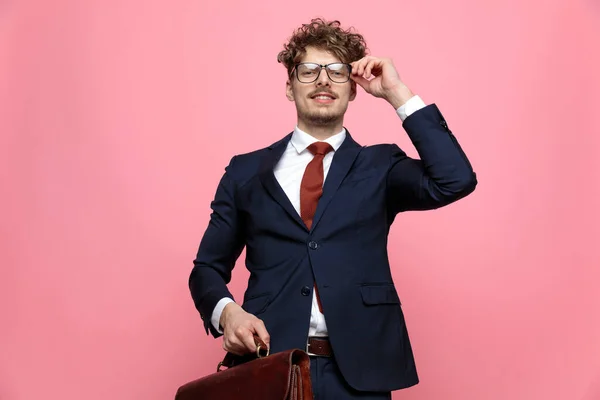 Elegant Young Man Navy Blue Suit Holding Bad Adjusting Glasses — Stock Photo, Image