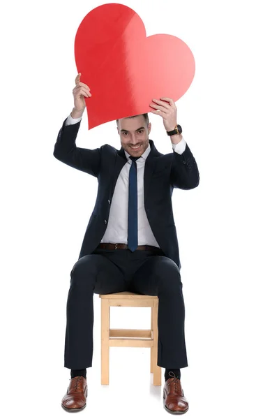 Happy Businessman Laughing Holding Heart Shape His Head While Sitting — Stock Photo, Image