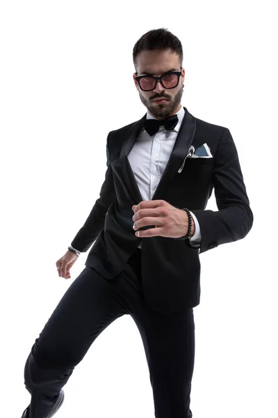 Serious Cool Man Tuxedo Holding Knee Hands Fashion Pose Isolated — Stock Photo, Image