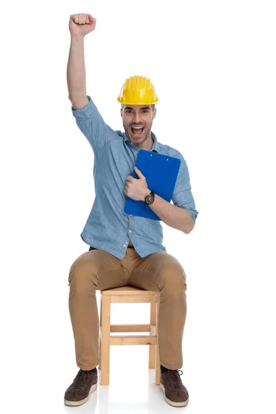 Cheerful Smart Casual Man Wearing Safety Helmet Celebrating Clipboard Hand — Stock Photo, Image