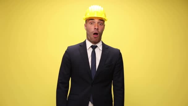 Handsome Businessman Helmet Shocked Raising His Hands Slapping His Face — Stock Video