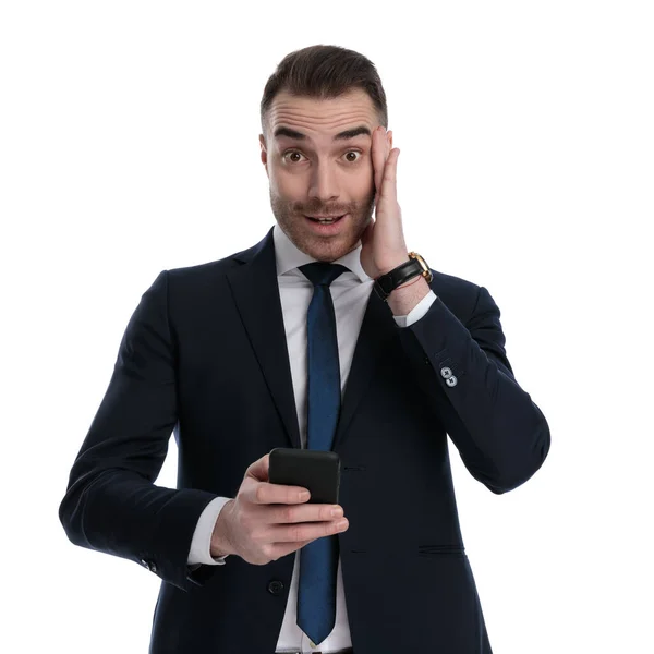 Smiling Businessman Holding Phone Gossiping While Standing White Studio Background — Stock Photo, Image