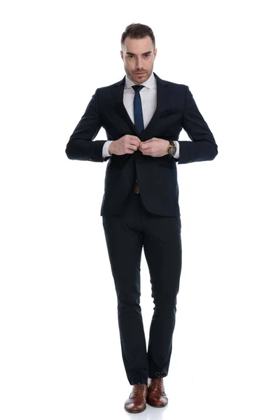 Confident Businessman Unbuttoning Jacket While Stepping White Studio Background — Stock Photo, Image