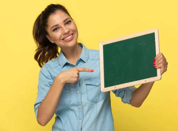 Young Casual Woman Holding Pointing Blackboard Smiling While Standing Yellow — Stock Photo, Image