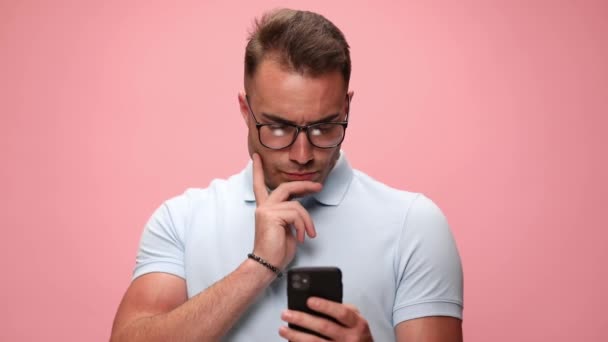 Fashion Model Looking His Phone Being Thoughtful Scratching His Face — Stock Video