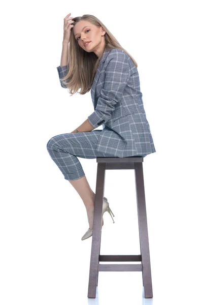 Side View Confident Businesswoman Blue Checkered Suit Arranging Hair Hair — Stock Photo, Image