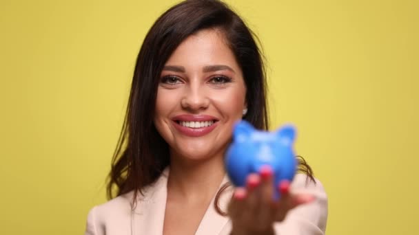 Beautiful Businesswoman Putting Coins Her Piggy Bank Celebrating Succes — Stock Video