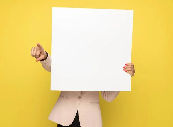 Young Woman Pink Suit Hiding Empty Board Pointing Finger Standing — Stock Photo, Image