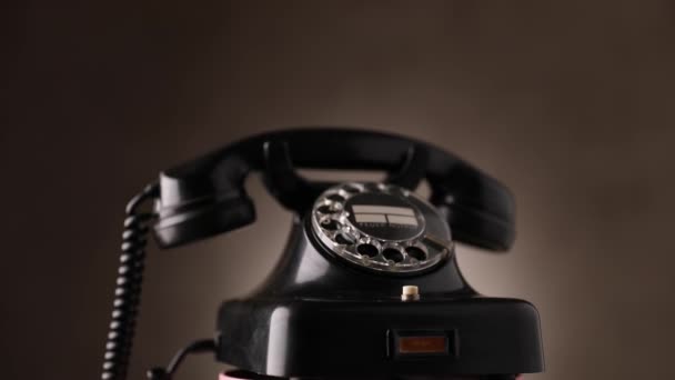 Old Rotary Telephone Spinning Brown Background Studio — Stock Video