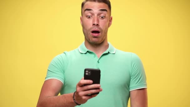 Young Casual Man Looking His Telephone Being Shocked Making Puppy — Stock Video