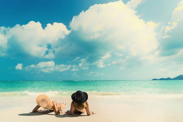 Woman suntanning - Winter holidays at the tropical beach