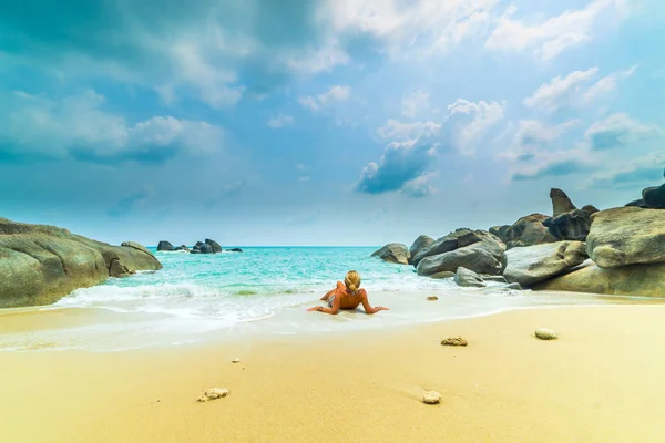 Woman suntanning - Winter holidays at the tropical beach