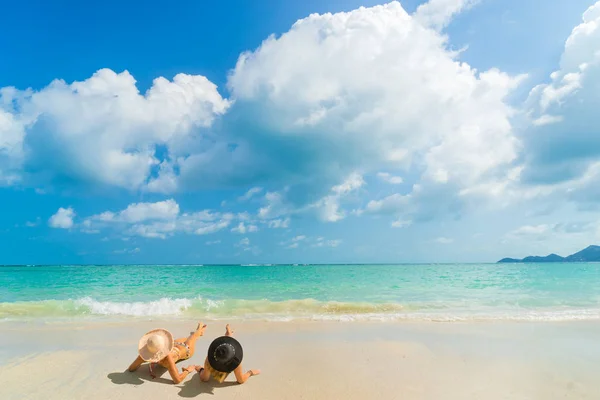 Woman suntanning - Winter holidays at the tropical beach