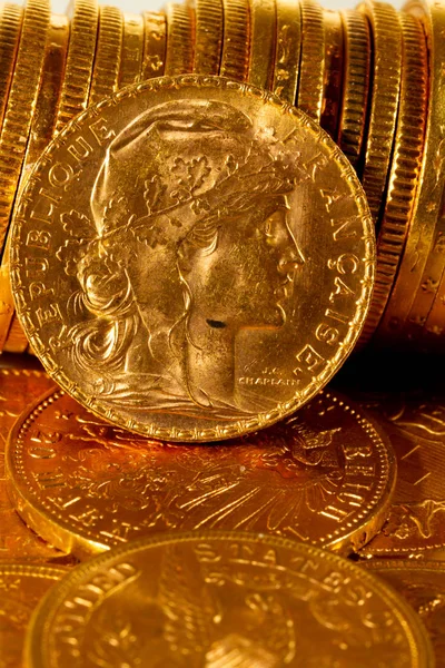 Real Gold coins over dark background