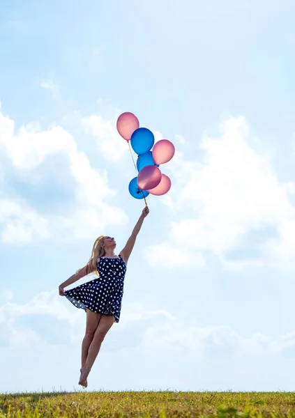 Female dancer holding balloons — Stock Photo, Image