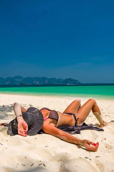 woman sunbathing on the tropical beach