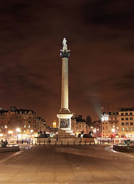London Trafalgar square with Nelsons column at night