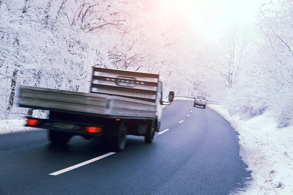 Light commercial vehicle on road in winter