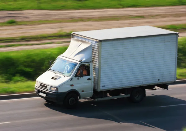 Blurred White Car Transporting Road — Stock Photo, Image