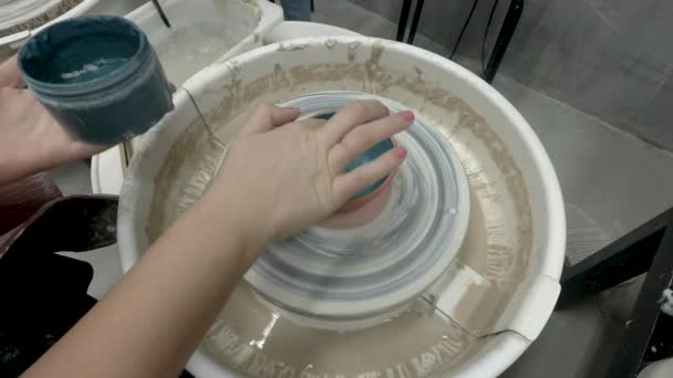 Point of view at painting the pottery — Stock Video