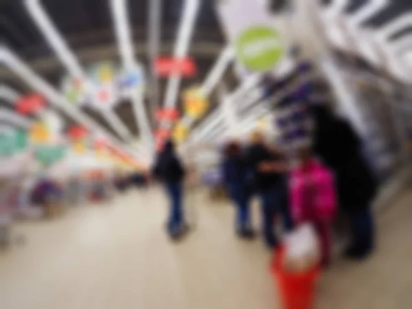 Gente comprando en grandes almacenes tema desenfoque fondo — Foto de Stock