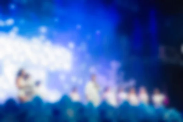 Blur background of people at the dj concert