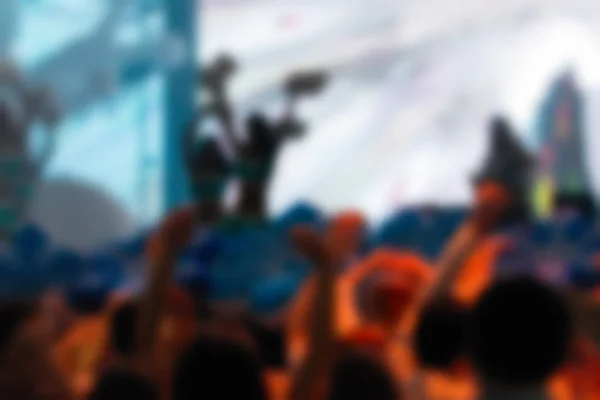 Blur background of people at the dj concert