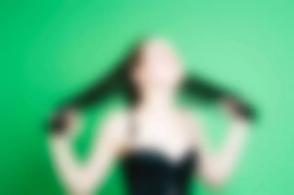 Žena nosí bdsm submisivní oblečení rozostření pozadí — Stock fotografie