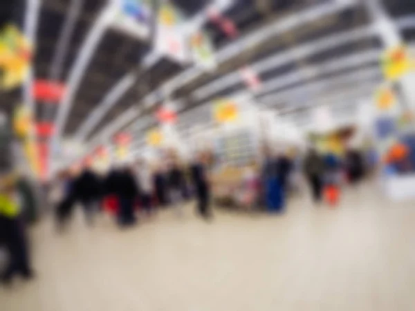 Menschen beim Einkaufen im Kaufhaus Thema verschwimmen Hintergrund — Stockfoto