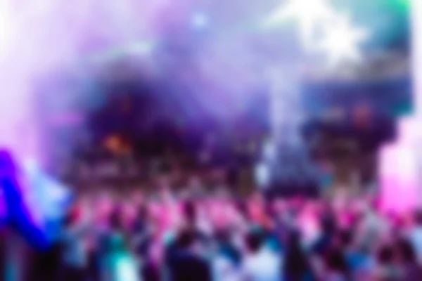 Blur background of people at the dj concert