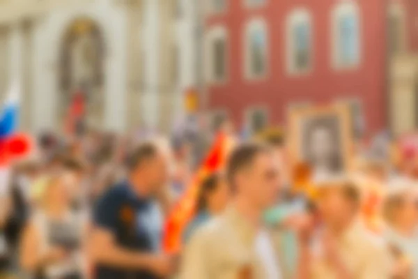 Grote menigte parade thema achtergrond wazig — Stockfoto