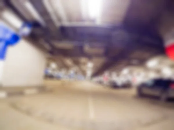 Parkeringsplats tema oskärpa bakgrund — Stockfoto